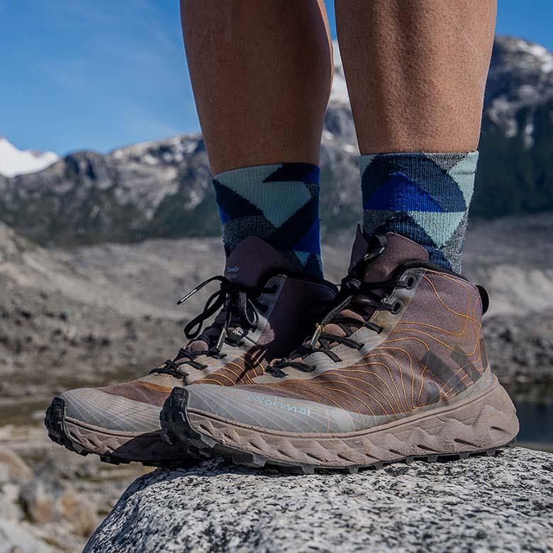 NNormal Tomir Waterproof hiking boots (standing on rock in mountains)
