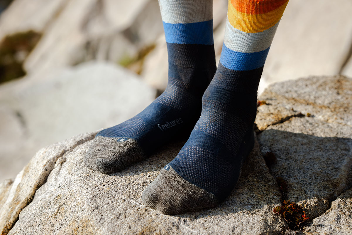 Hiking socks (closeup of Feetures Elite Light Cushion Mini Crew on rock)