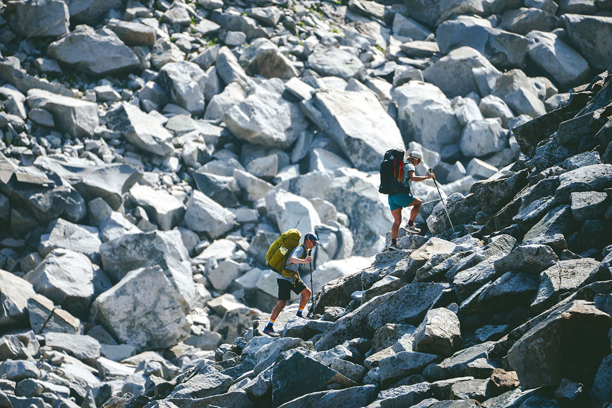 Hyperlite Mountain Gear Unbound 55 backpack (hiking up boulder field)