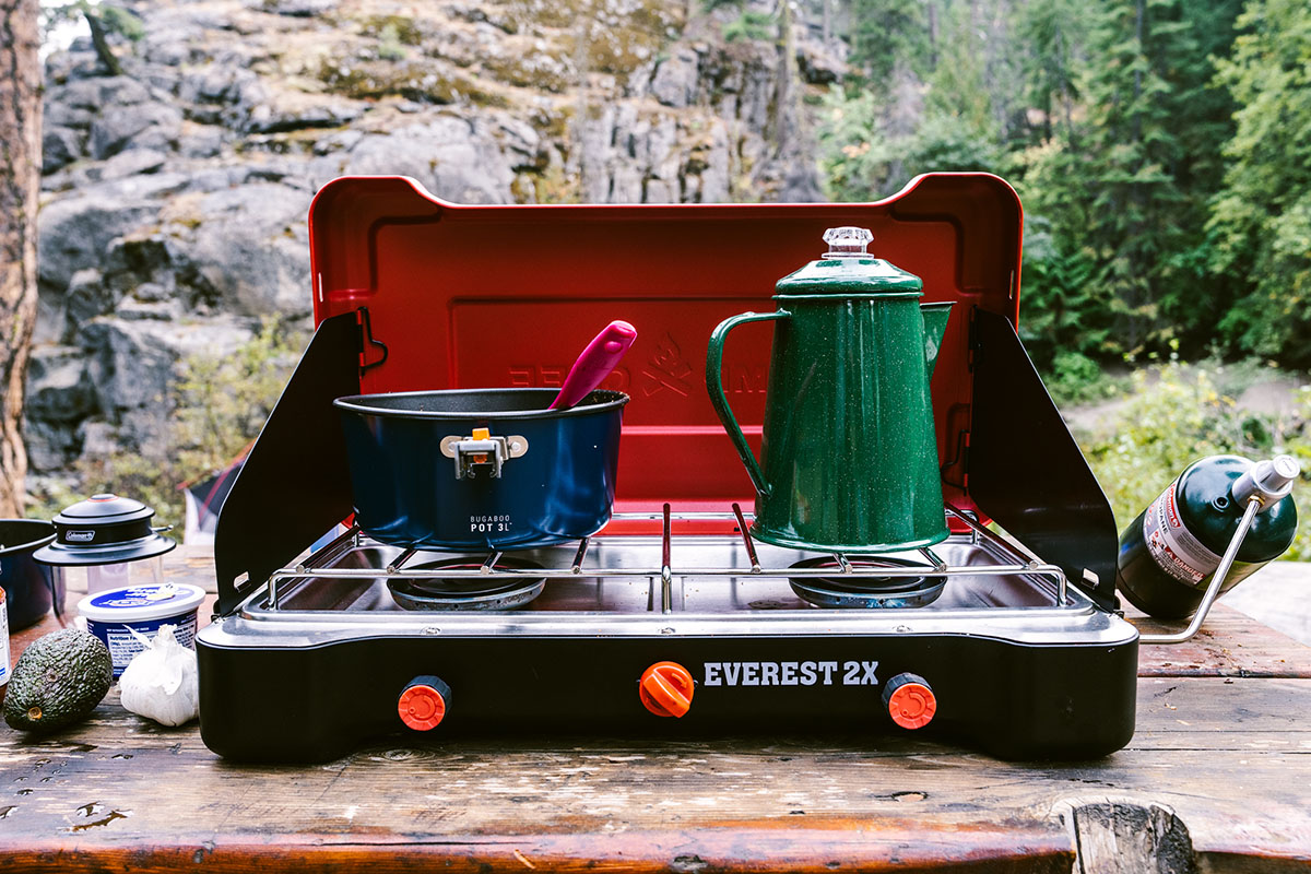 Camping stove (Camp Chef Everest 2X on picnic table)