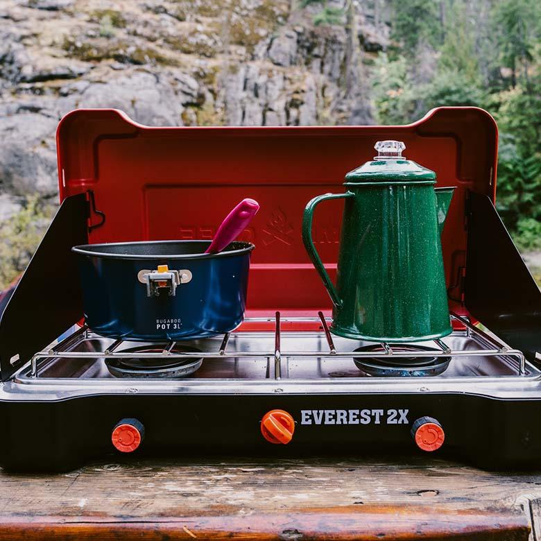 Camp stove (Camp Chef Everest 2X on picnic table)