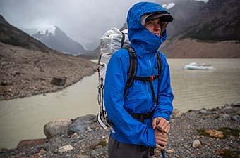 Helly Hansen Blaze 3 Layer Shell Jacket (standing in mountains with pack)