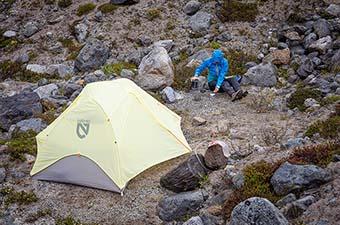 Nemo Mayfly Osmo 2P backpacking tent (pitched with rainfly at camp)