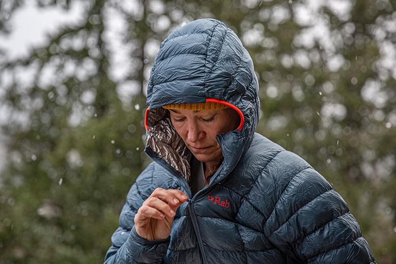 Down Fill and Insulation Explained (zipping up Rab Mythic G down jacket)