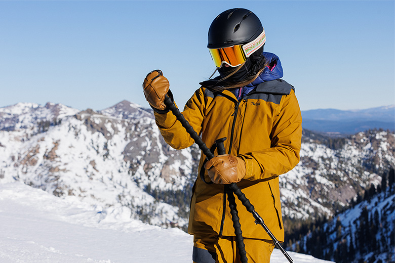 Trew Gear Astoria ski jacket (standing in mountains)