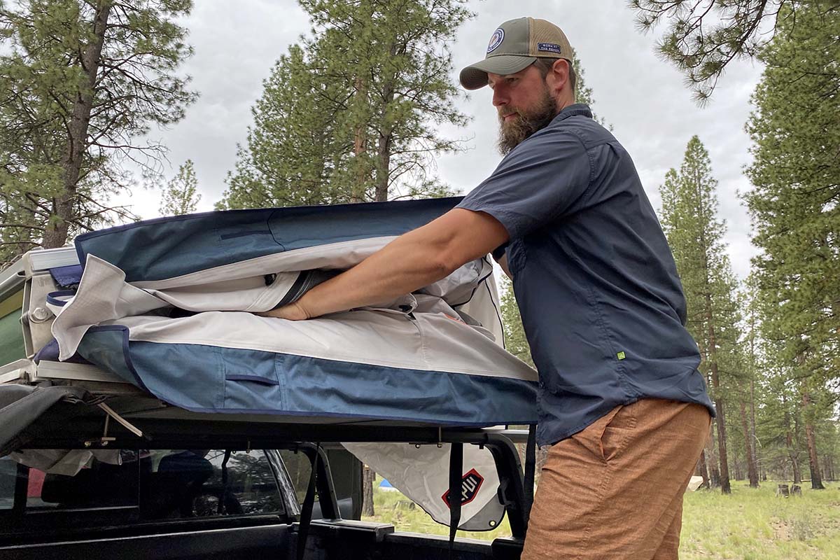 Stuffing away Tepui Low Pro rooftop tent