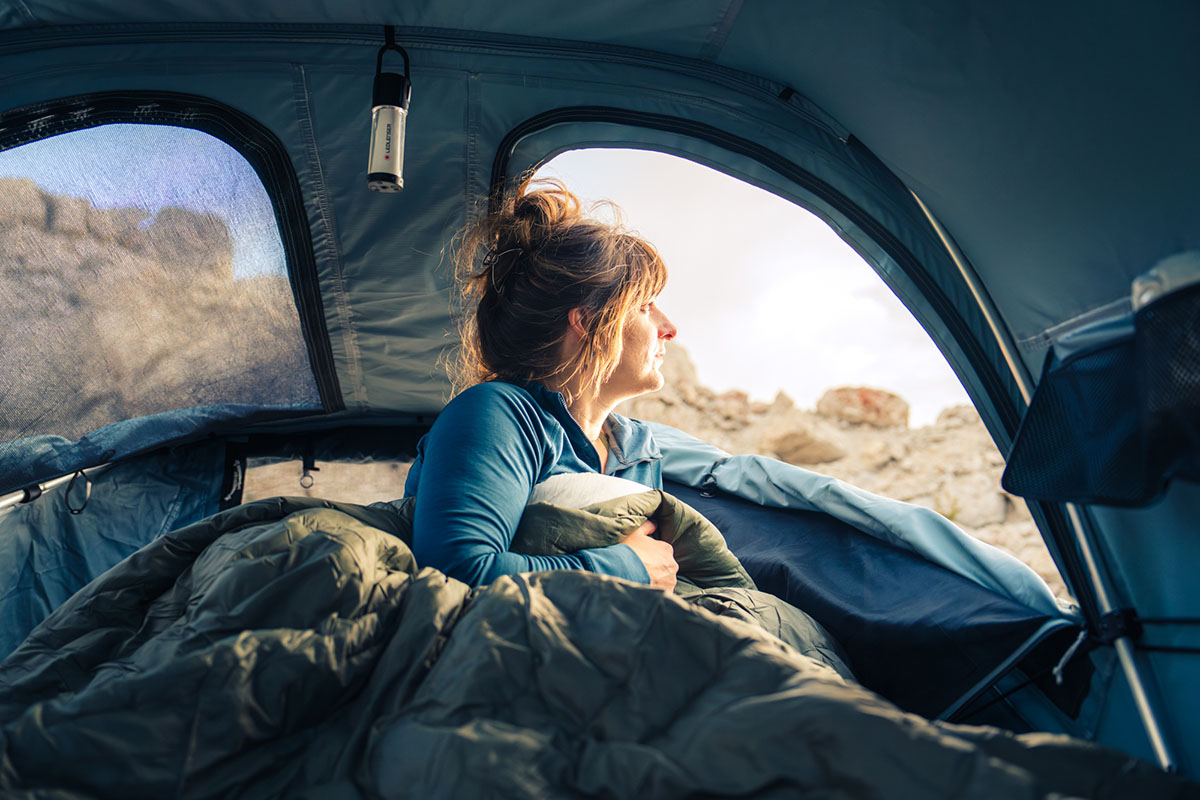 Camping sleeping bag (cozied up inside rooftop tent)