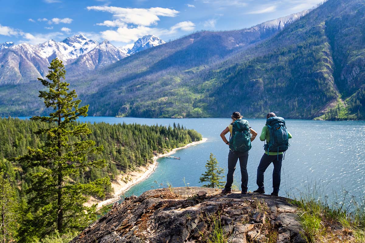 Backpacking backpacks (overlooking lake with Osprey Eja and Exos)