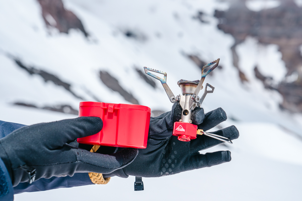 Backpacking Stoves (Holding the MSR PocketRocket 2 and its case)