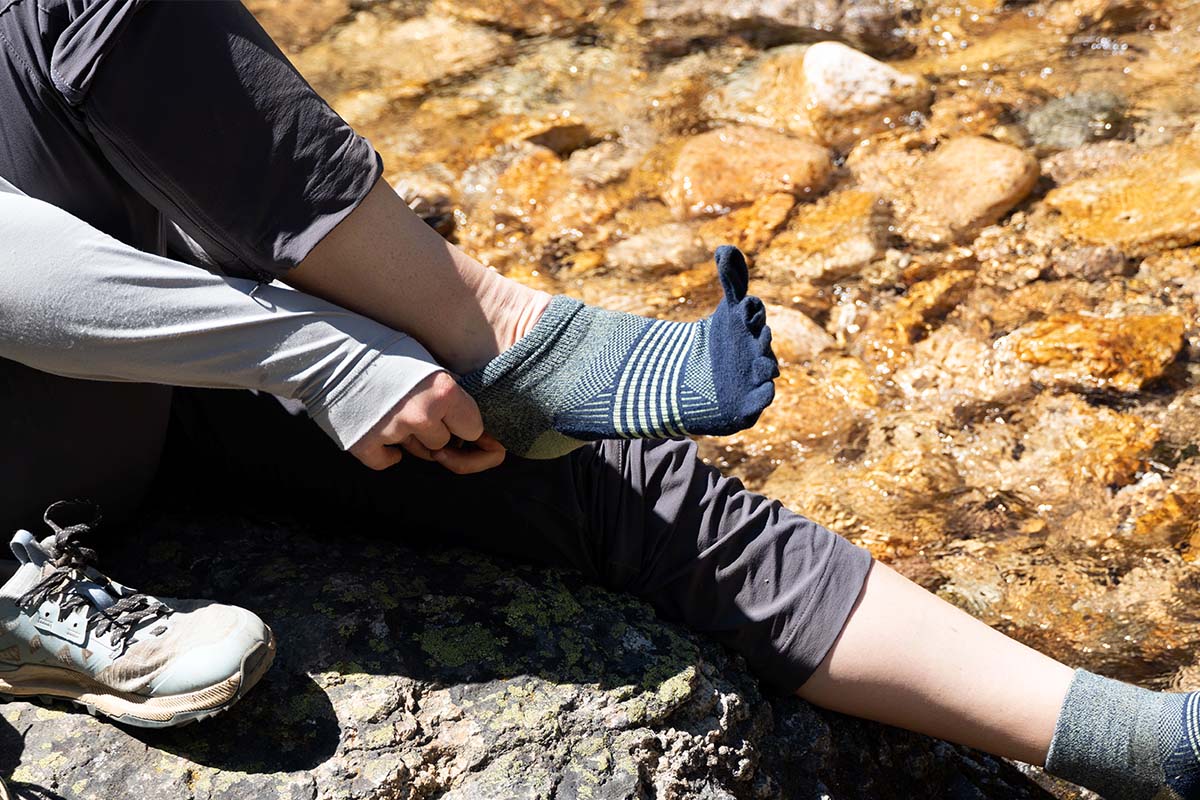 Hiking socks (putting on Injinji toe socks by water)