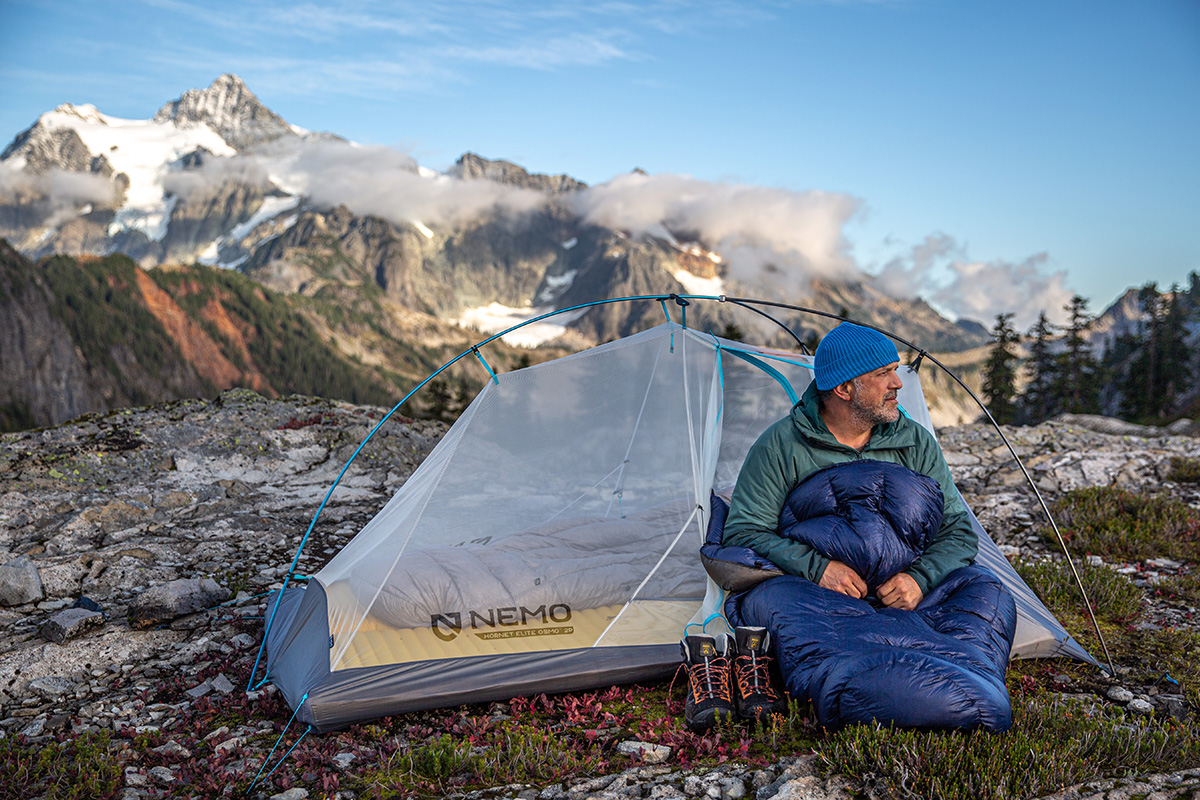 Backpacking sleeping bag (sitting in mountains with Enlightened Equipment Enigma Quilt)