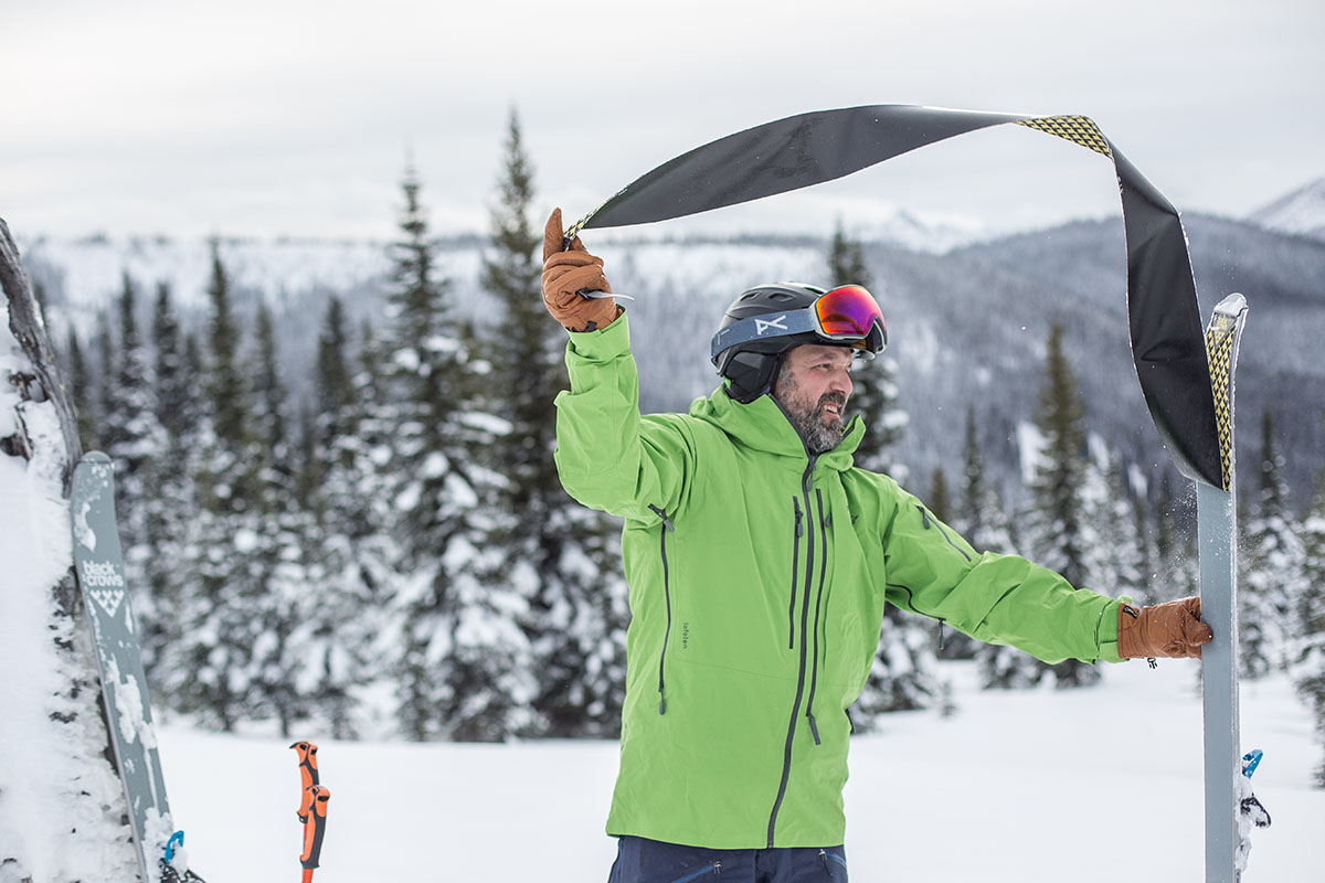 Men's ski jacket (ripping skins off wearing Norrona Lofoten)