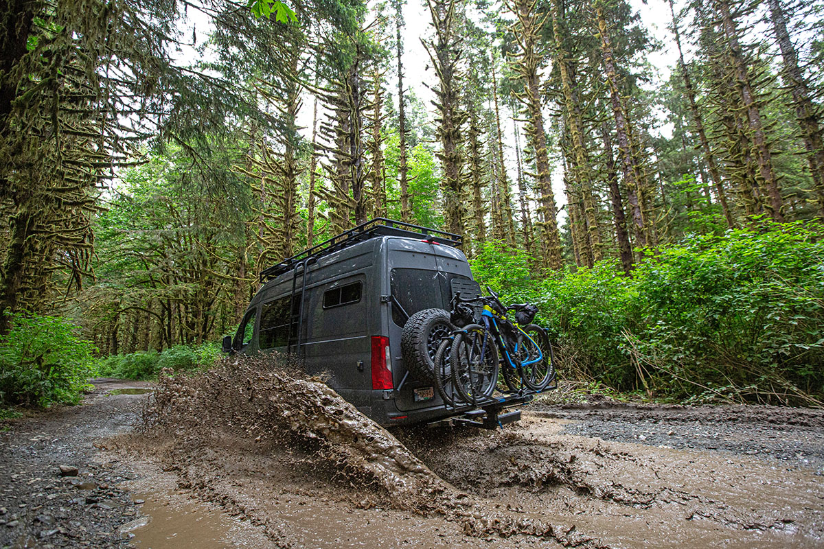 Hitch rack (RockyMounts AfterParty on back of van in mud)