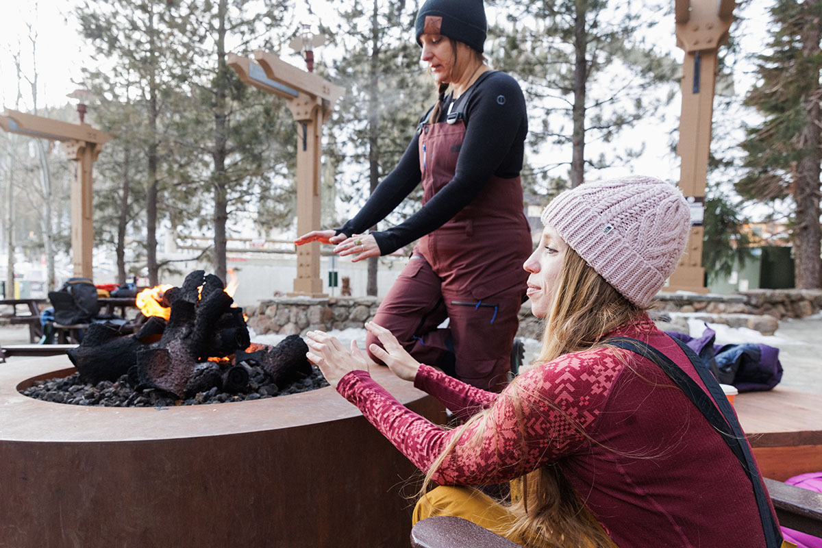 Baselayer (warming hands over fire wearing Kari Traa Rose)