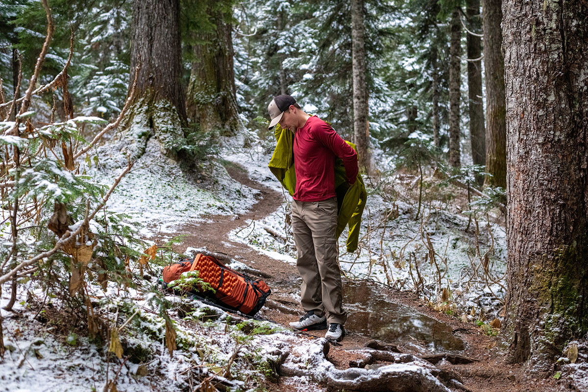 Men's baselayer (putting on jacket)