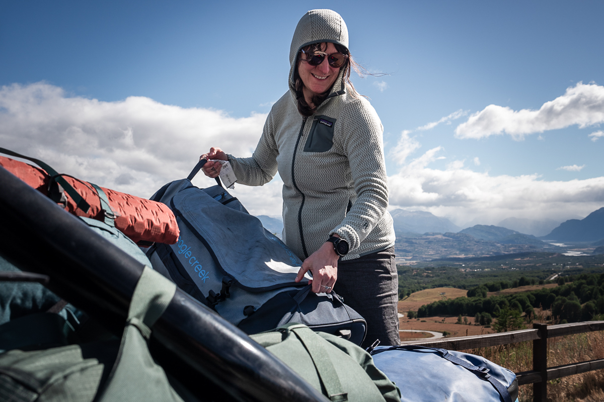 Wheeled Duffels (pulling wheeled duffels out of a truck bed)