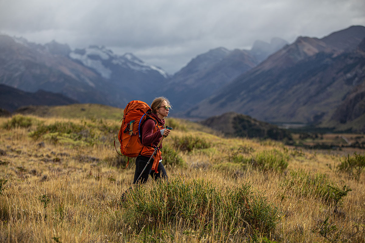 Women's backpacking pack (Gregory Jade 63 hiking through tall grass) 