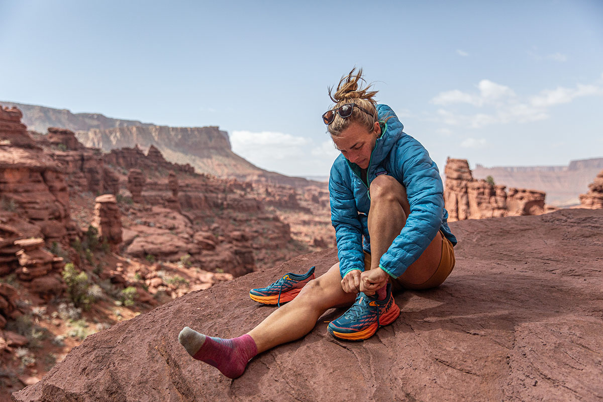 Women's hiking shoe (putting on Hoka Speedgoat 5)