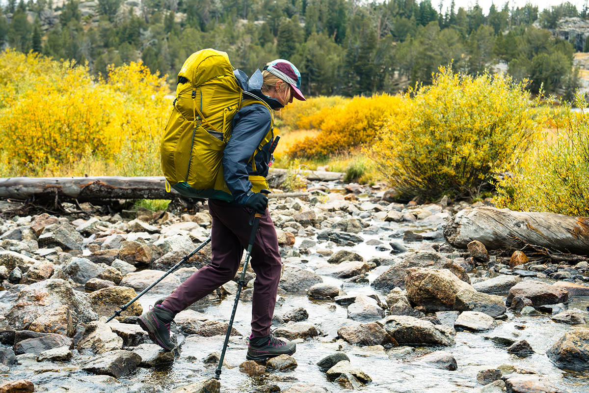 Women's rain jacket (walking through stream wearing Arc'teryx Beta SL)