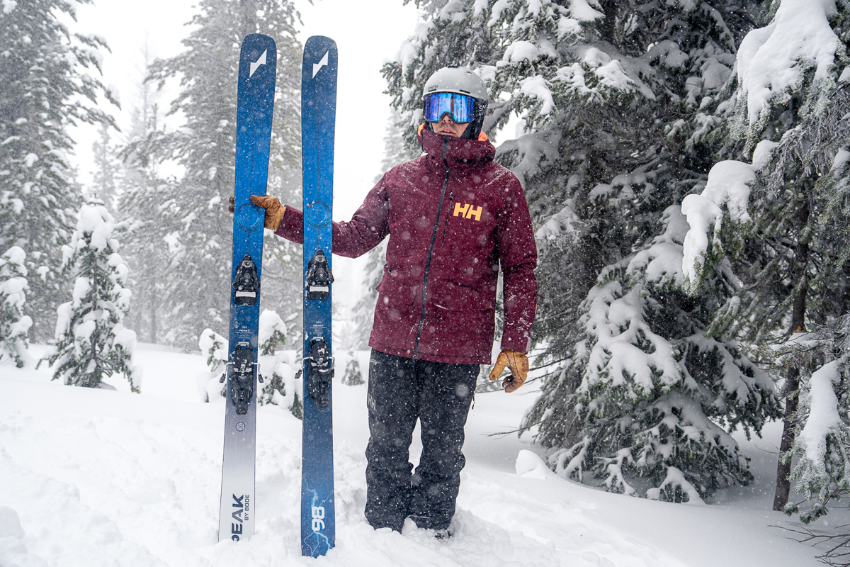 Helly Hansen Ridge Infinity Shell Bibs (standing with skis)