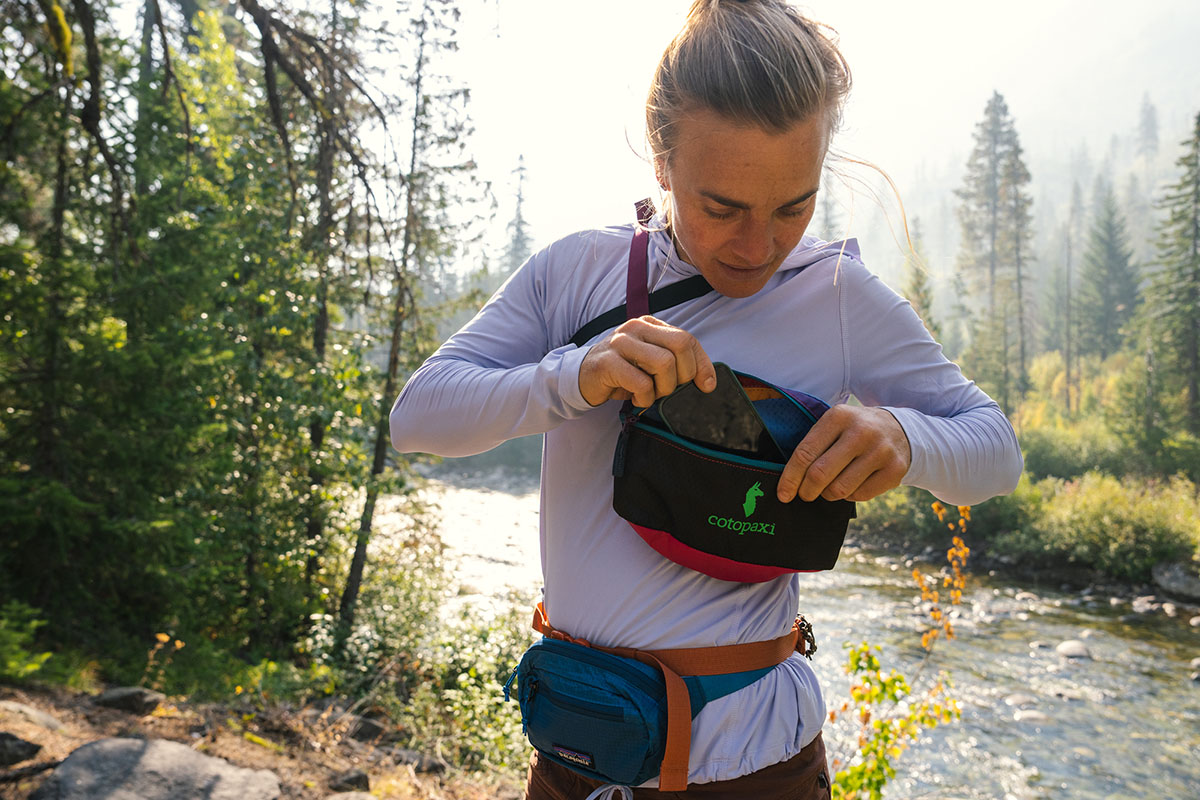 Mountain Hardwear Crater Lake Hoody (reaching into fanny pack)