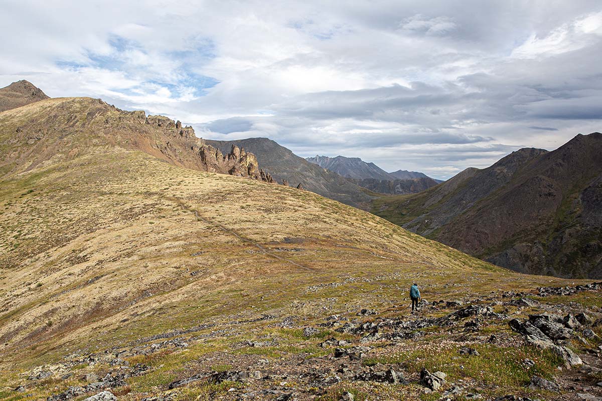 Osprey Renn 65 backpack (wide shot in mountains)