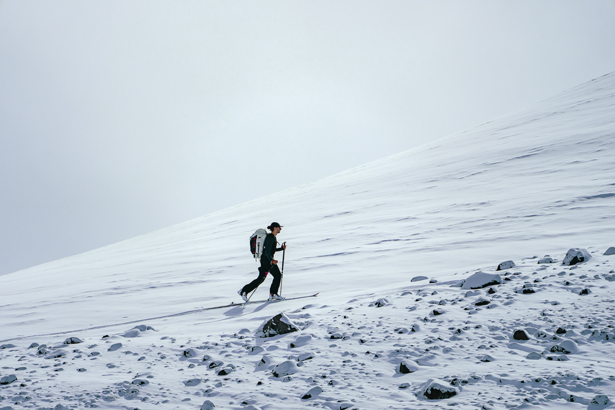 Outdoor Research Skytour AscentShell Bib (skiing by snow covered rocks)