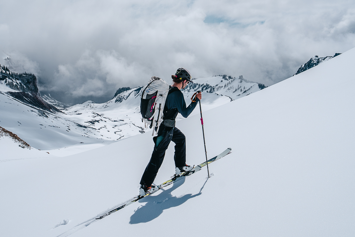 Outdoor Research Skytour AscentShell Bib (skinning up steep hill)