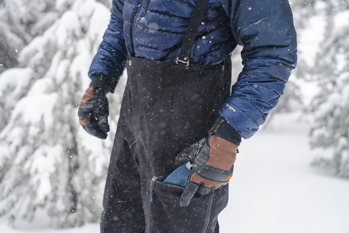 Patagonia Untracked Bibs (putting phone in leg pocket)