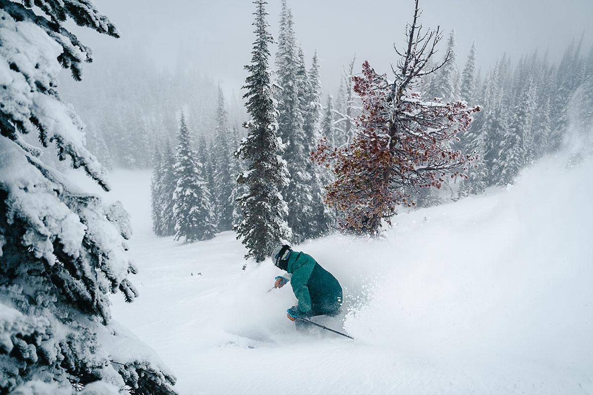 REI Co-op First Chair GTX ski jacket (shot from back while skiing)