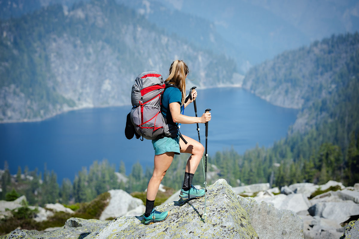 _Topo Athletic Ultraventure 3 (standing on rock above lake)