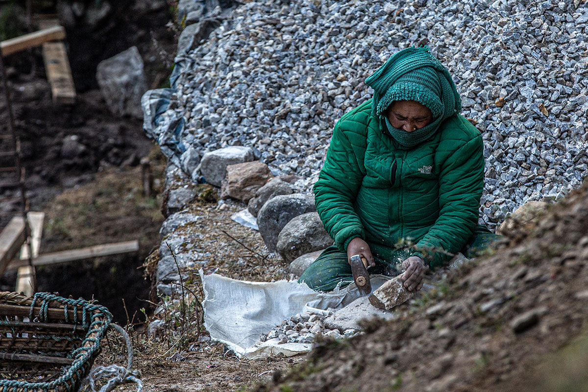 Nepal Trek (woman making gravel)