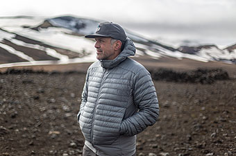 Arc'teryx Cerium Hybrid Hoody (standing in mountains)