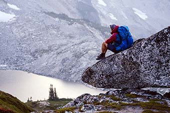 Backcountry Labor Day Sale (overlooking lake wearing Osprey Exos 58L)