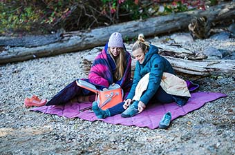 Backcountry Semi-Annual Sale (sitting on beach with camp blankets)