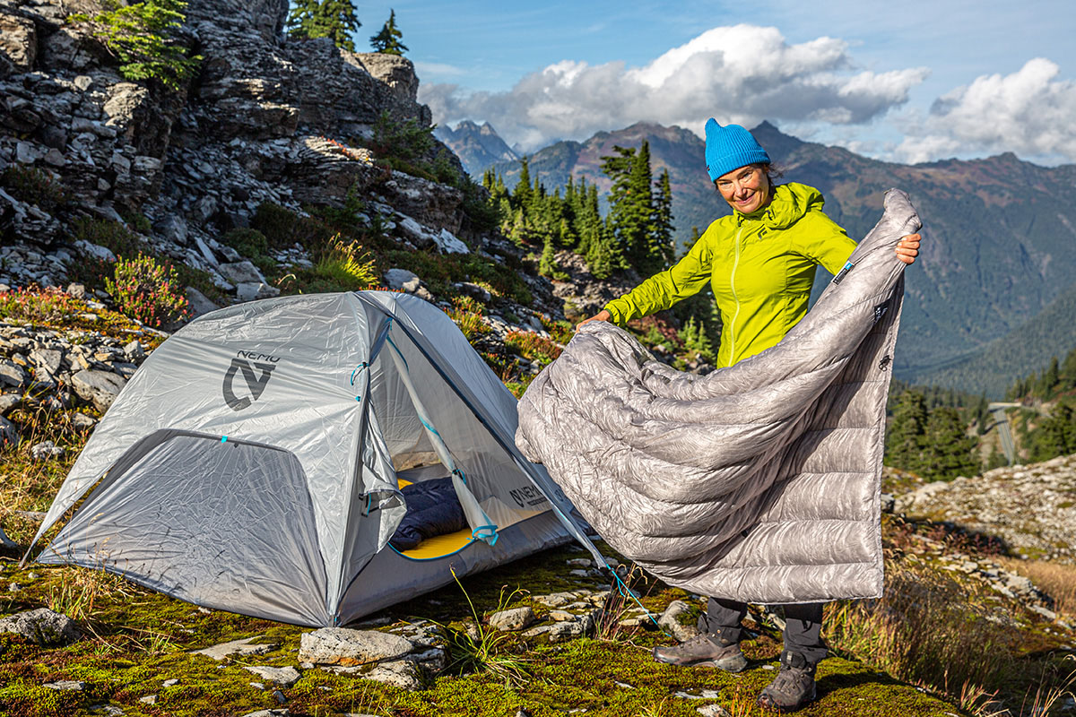 Hyperlite Mountain Gear 20 Degree Quilt (holding quilt outside tent)