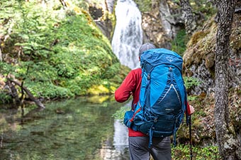 Osprey Atmos AG LT 65 backpack (waterfall view)