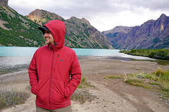 Outdoor Research Refuge Hooded synthetic jacket (smiling in front of lake)