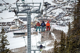 REI Co-op End of Season Clearance (sitting on chairlift at ski resort)