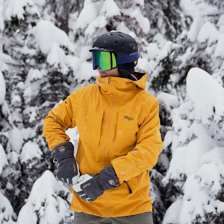 ​​Trew Gear Cosmic Primo Jacket (standing in front of snowy backdrop)