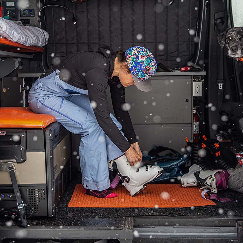 Women's ski boots (putting on boots in van)