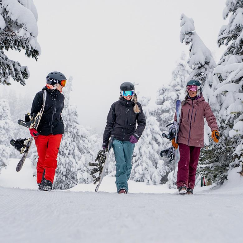 Backcountry Holiday Gift Guide (group shot hiking with snowboards)